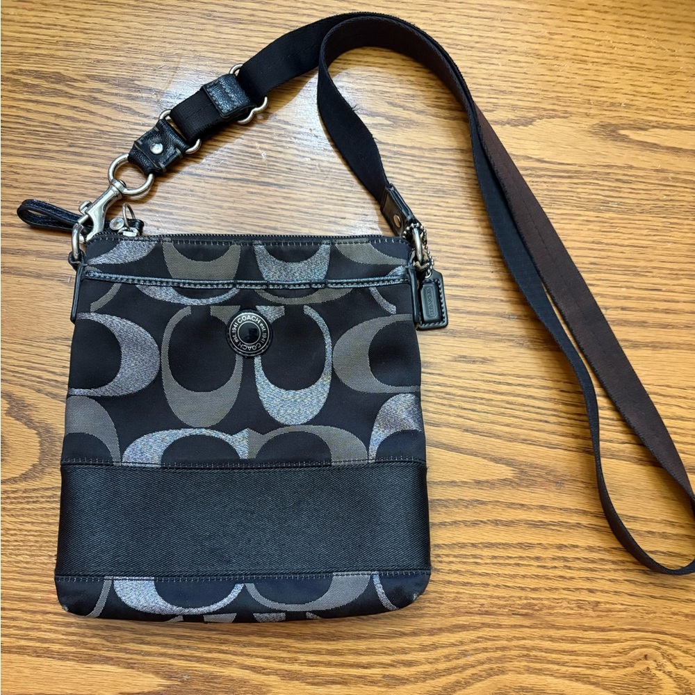 Black and silver Coach Swingback Bag